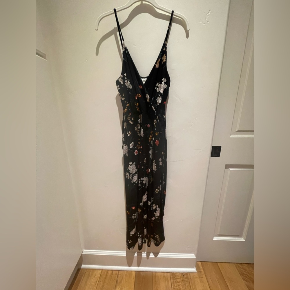 Kaleigh romper. Black with a beautiful floral pattern.